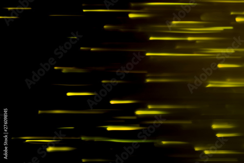 Yellow light that is moving on a black background