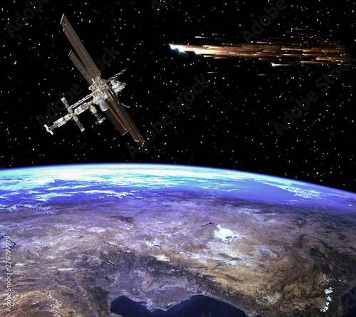 Fototapeta Naklejka Na Ścianę i Meble -  Space station above the earth. Meteors, comets in space. The elements of this image furnished by NASA.