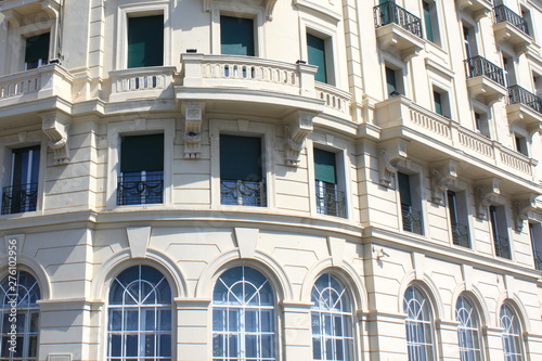 Traditional facade of European architecture with windows and balconies