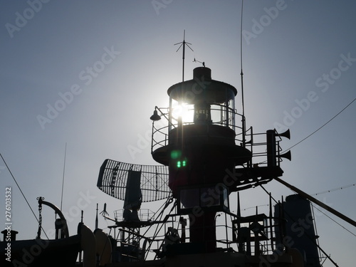 Lighthouse boat top and radar in background on warship