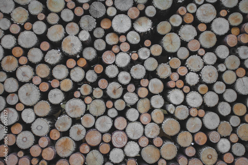 background made of wooden logs lying on top of each other.