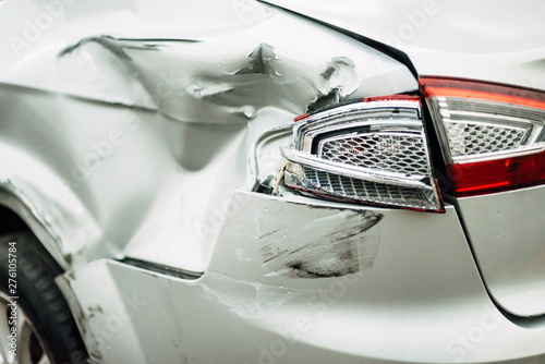 dents on the car door caused by an accident on the road