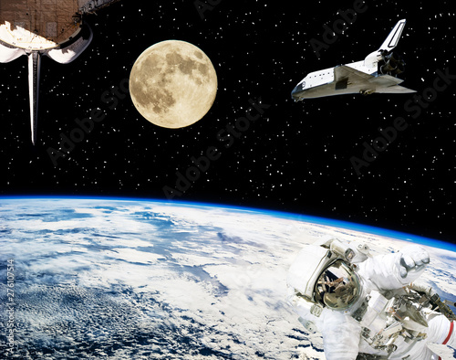 Astronaut, spaceships and moon. Earth on the backdrop. The elements of this image furnished by NASA.