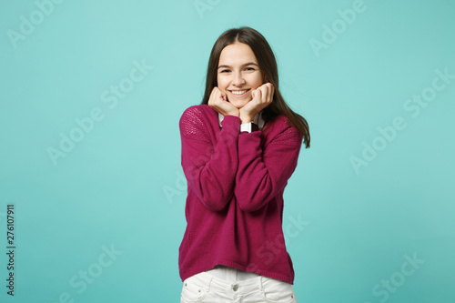 Canvastavla Young brunette woman girl in casual clothes posing isolated on blue green turquoise wall background studio portrait