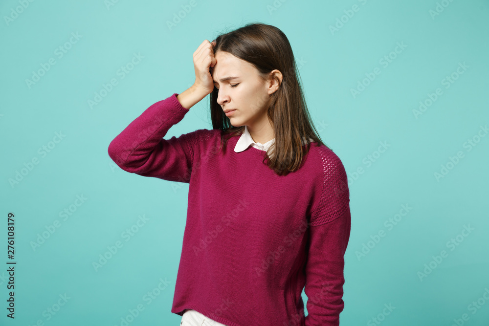 Young fun sad upset perplexed disturb brunette woman girl in red casual clothes posing isolated on blue wall background studio portrait. People sincere emotions lifestyle concept. Mock up copy space. Young fun sad upset perplexed disturb brunette woman girl in red casual clothes posing isolated on blue wall background studio portrait. People sincere emotions lifestyle concept. Mock up copy space.