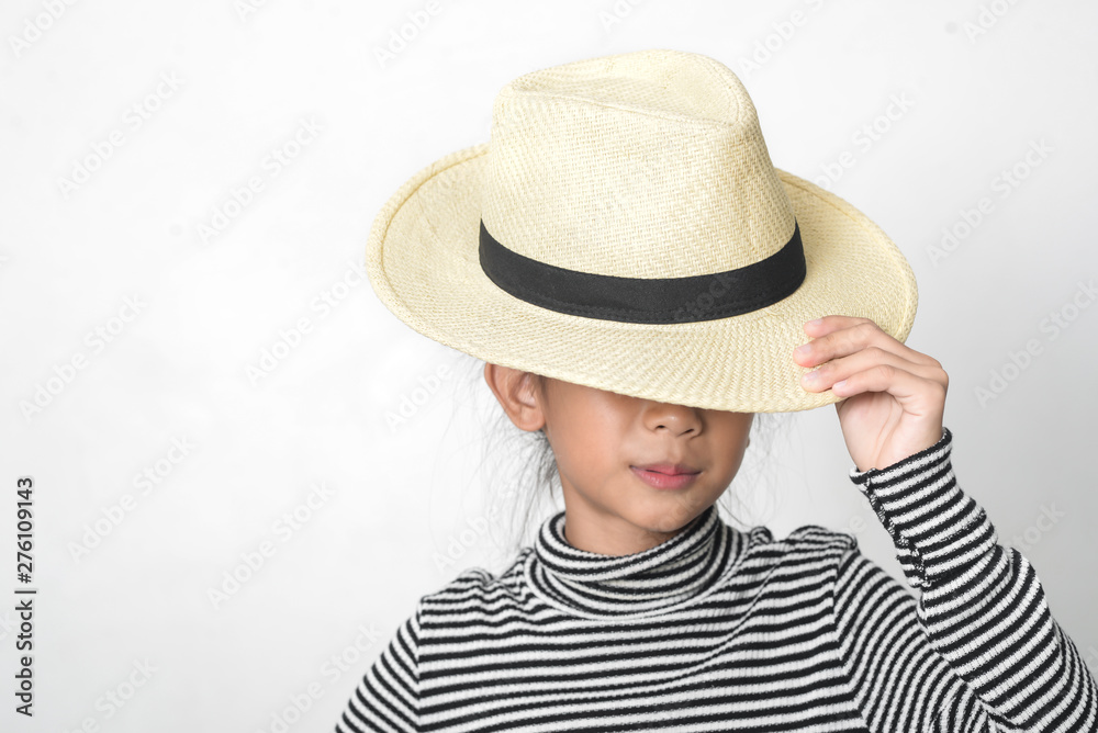 Happy Asian girl waering turtle neck and straw hat on white background. Happy Asian girl waering turtle neck and straw hat on white background.