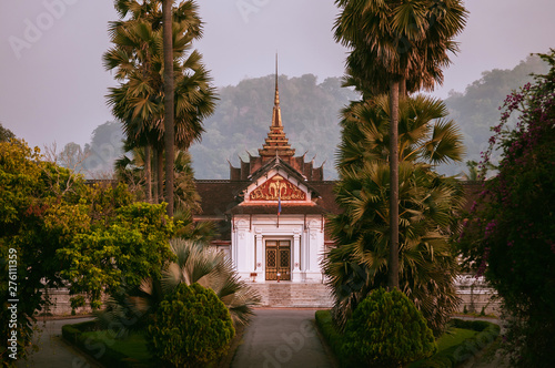 Canvas Print Luang Prabang Royal Palace Museum among palm tree in morning