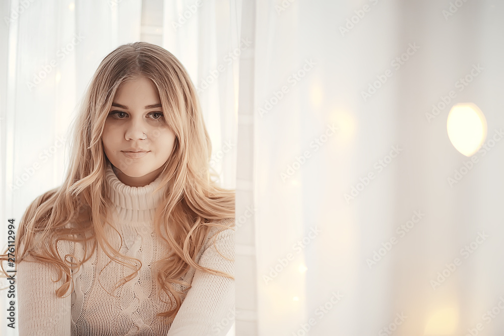 cute blonde sweater portrait / winter look, portrait of beautiful model with long hair in cold season cute blonde sweater portrait / winter look, portrait of beautiful model with long hair in cold season