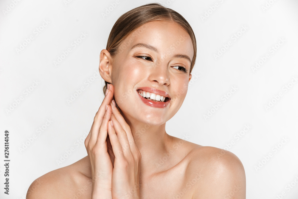 Beautiful young woman with healthy glowy skin posing isolated over white wall background. Beautiful young woman with healthy glowy skin posing isolated over white wall background.