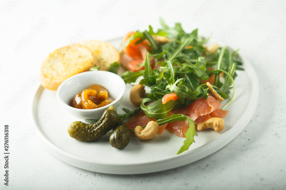 Smoked salmon arugula salad with pickles Smoked salmon arugula salad with pickles