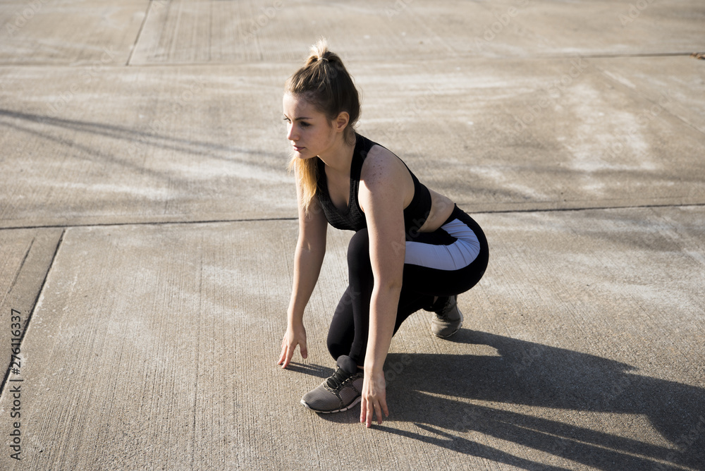 Young woman doing exercises at the street Young woman doing exercises at the street