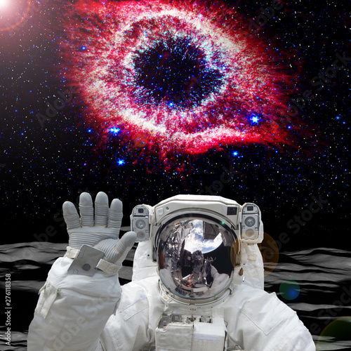 Astronaut on the alien planet. Beautiful view behind. The elements of this image furnished by NASA.