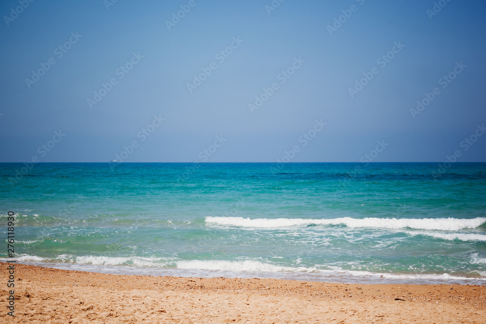Mediterranean beach with turquoise water in sunny weather Mediterranean beach with turquoise water in sunny weather
