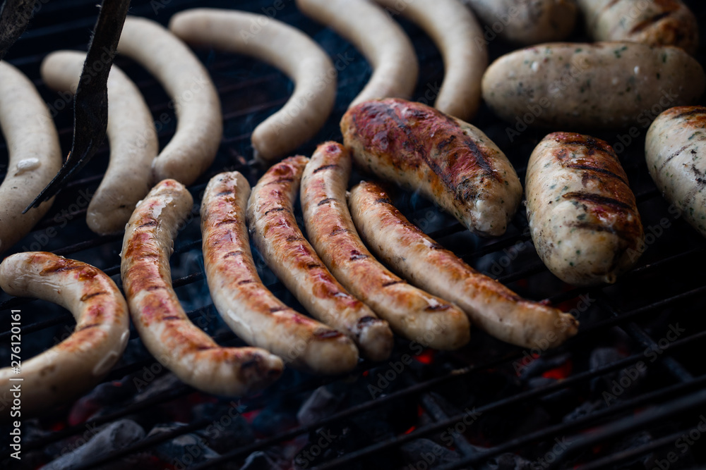 Cooking sausages on the barbecue grill. Grilled sausages. Cooking sausages on the barbecue grill. Grilled sausages.