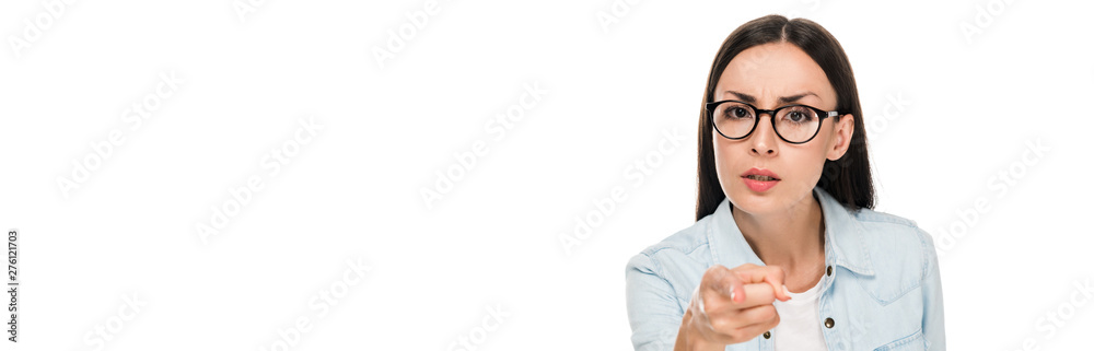 angry brunette girl in glasses in denim jacket pointing with finger at camera isolated on white, panoramic shot angry brunette girl in glasses in denim jacket pointing with finger at camera isolated on white, panoramic shot