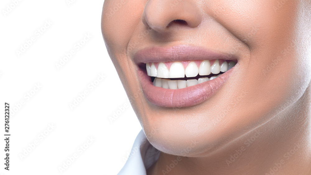 Close up view of a woman smiling. Teeth whitening concept. Close up view of a woman smiling. Teeth whitening concept.