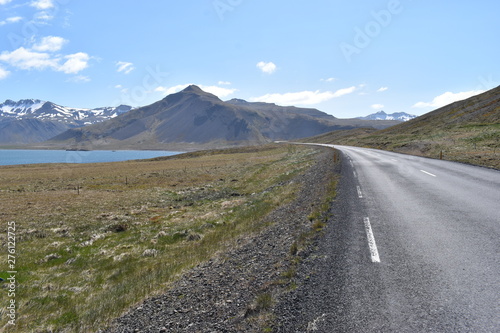 The street with Mountains and a blue lake in Iceland