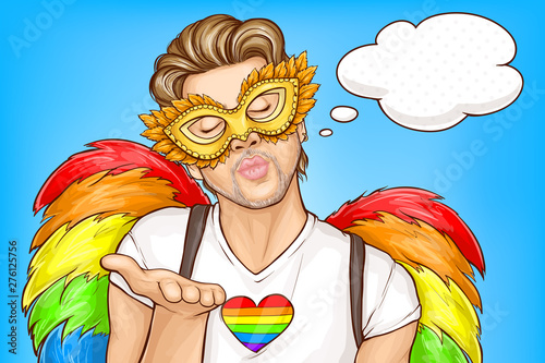 Gay pride parade pop art vector concept, banner template. Handsome homosexual man wearing carnival face mask, rainbow color feather wings, closing eyes and blowing air kiss illustration, think bubble