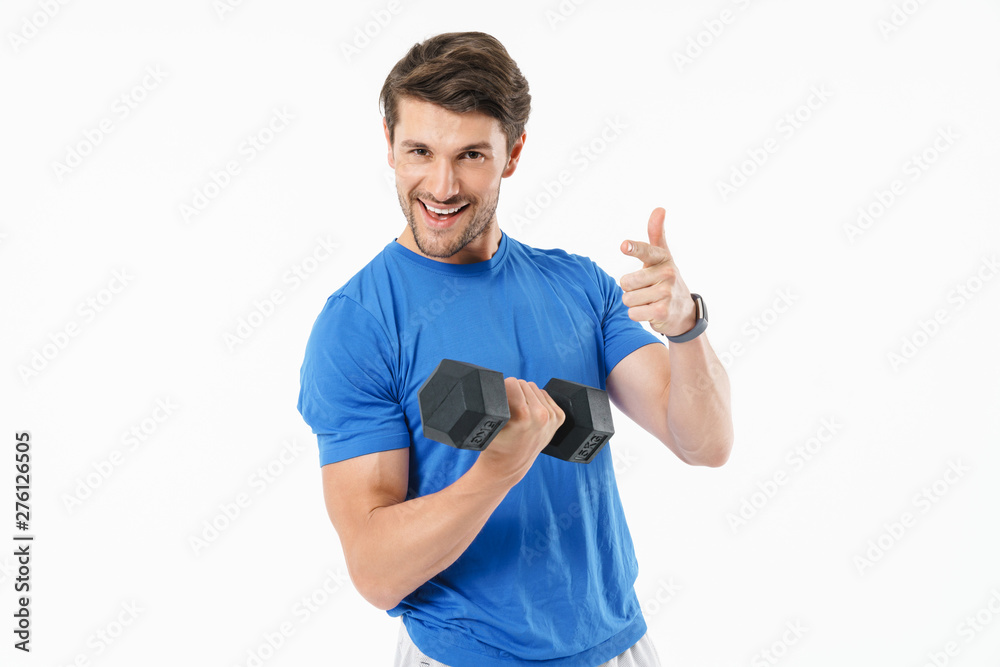Attractive young fit sportsman wearing t-shirt standing