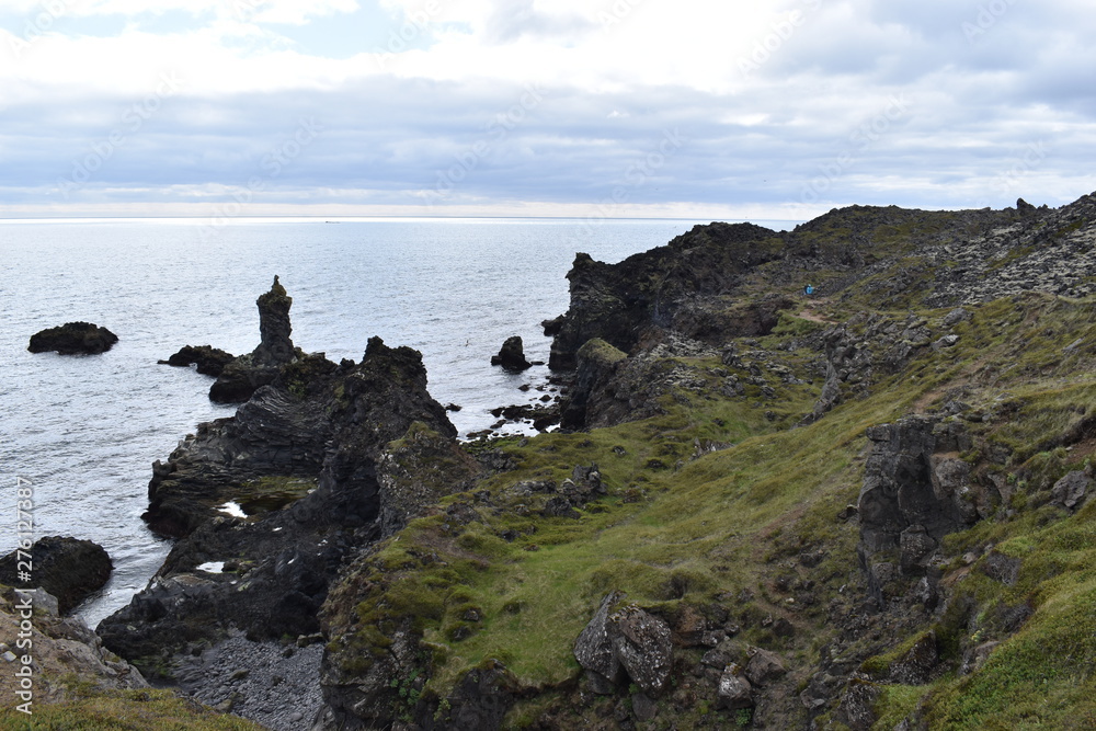 Hiking trail from Anarstapi to Hellnar with the raw ocean und big rocks and mountains in the west of Iceland at Snaefellsnes Peninsula Hiking trail from Anarstapi to Hellnar with the raw ocean und big rocks and mountains in the west of Iceland at Snaefellsnes Peninsula