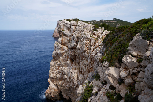 Capo Caccia, Foradada. Imposing white limestone cliff, in Sardinia/Sardegna, Italy