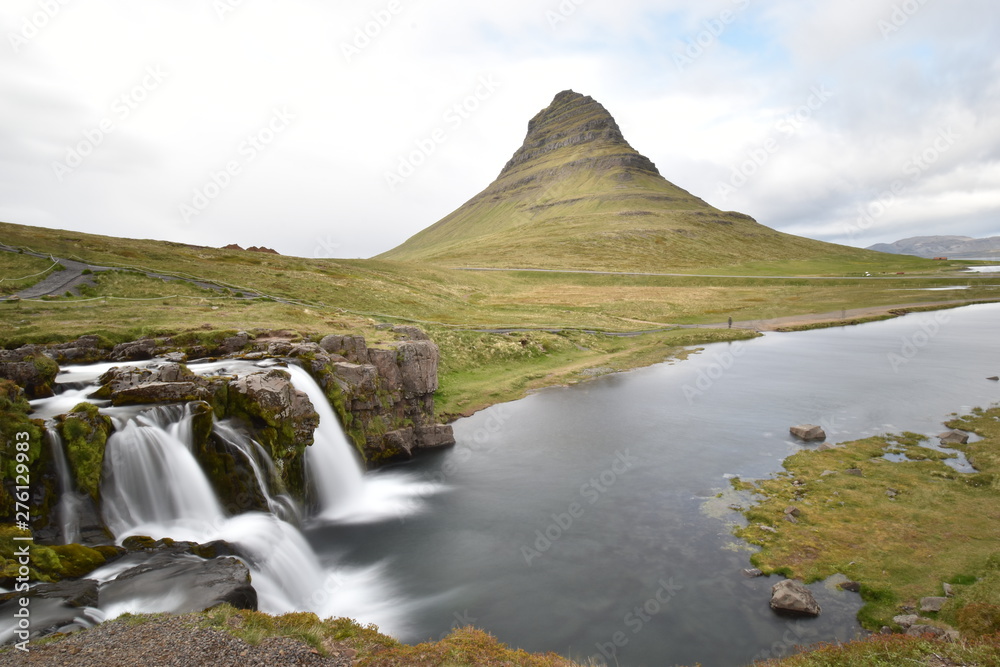 Famous kirkjufell mountain with the kirkjufell falls waterfalls in front in Grundarfjödur in Iceland