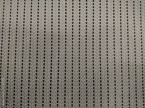 Unusual plastic texture, beige color, background.
