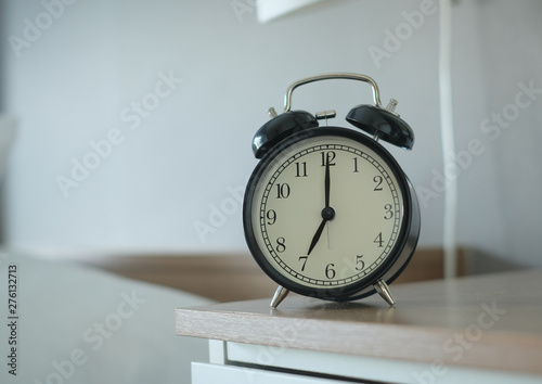 Alarm clock on grey background with copy space for you design.