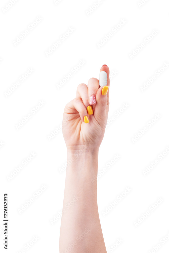 Woman's hand with a pill on a white background Woman's hand with a pill on a white background