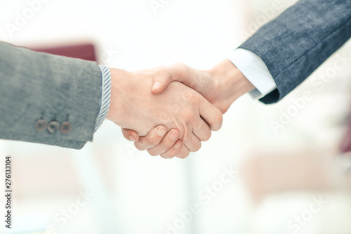 close up.handshake business partners in the workplace in the office