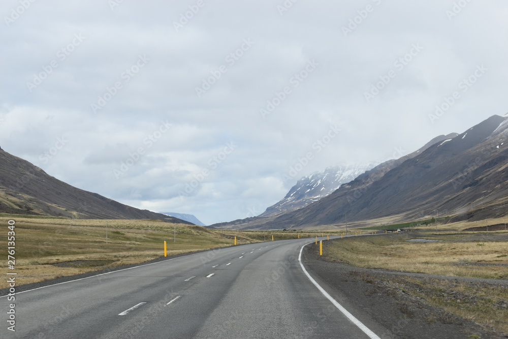 The street with Mountains in Iceland The street with Mountains in Iceland