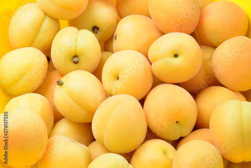 Ripe juicy orange apricots fruit background.