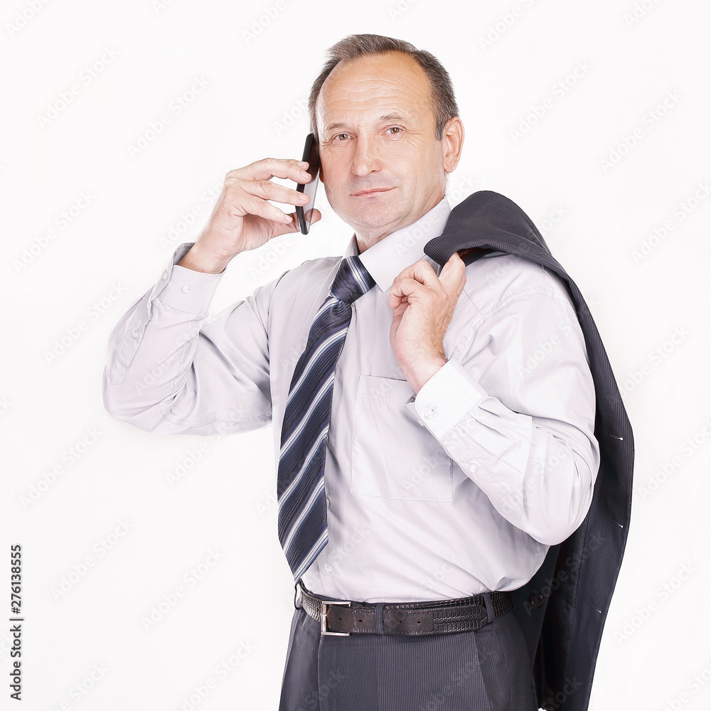 serious businessman talking on a mobile phone serious businessman talking on a mobile phone