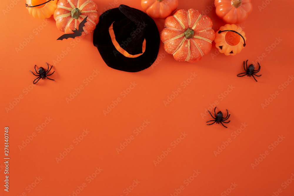Pumpkins decorations on orange paper - obrazy, fototapety, plakaty 