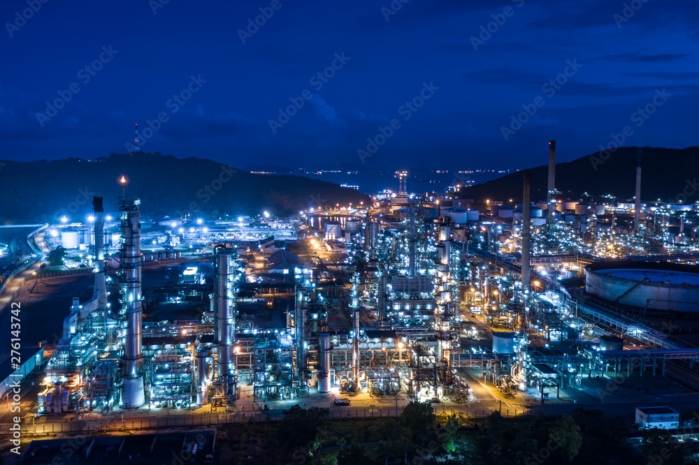 refinery oil and gas production industry and mountain with blue sky background at night