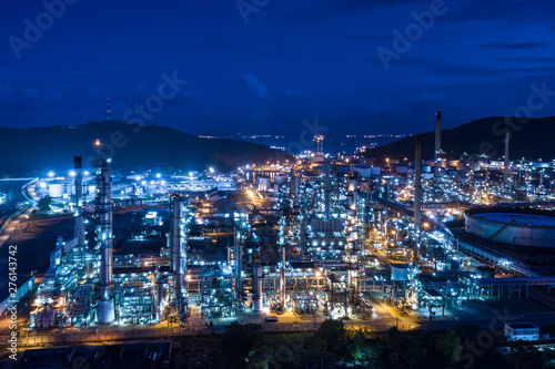 refinery oil and gas production industry and mountain with blue sky background at night © SHUTTER DIN