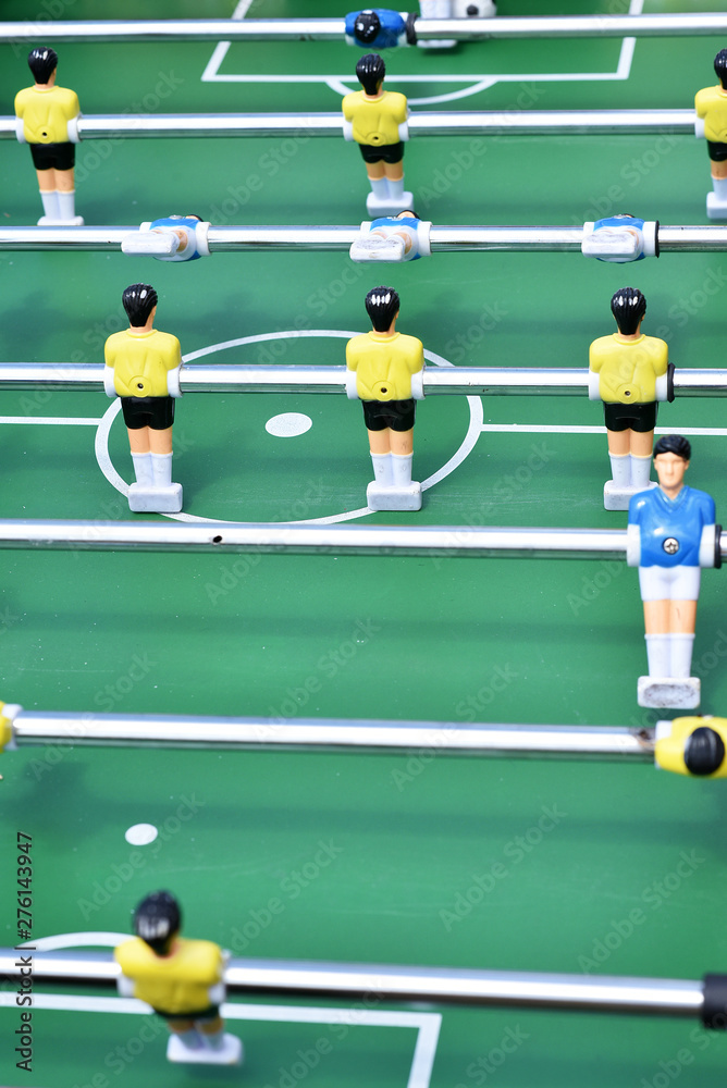 Table football, active game background, nice Bokeh. Sports game for children, mulricolored plastic figures. Relax and activity play, sport competition. Red and blue colors. Sport bar recreation theme Table football, active game background, nice Bokeh. Sports game for children, mulricolored plastic figures. Relax and activity play, sport competition. Red and blue colors. Sport bar recreation theme
