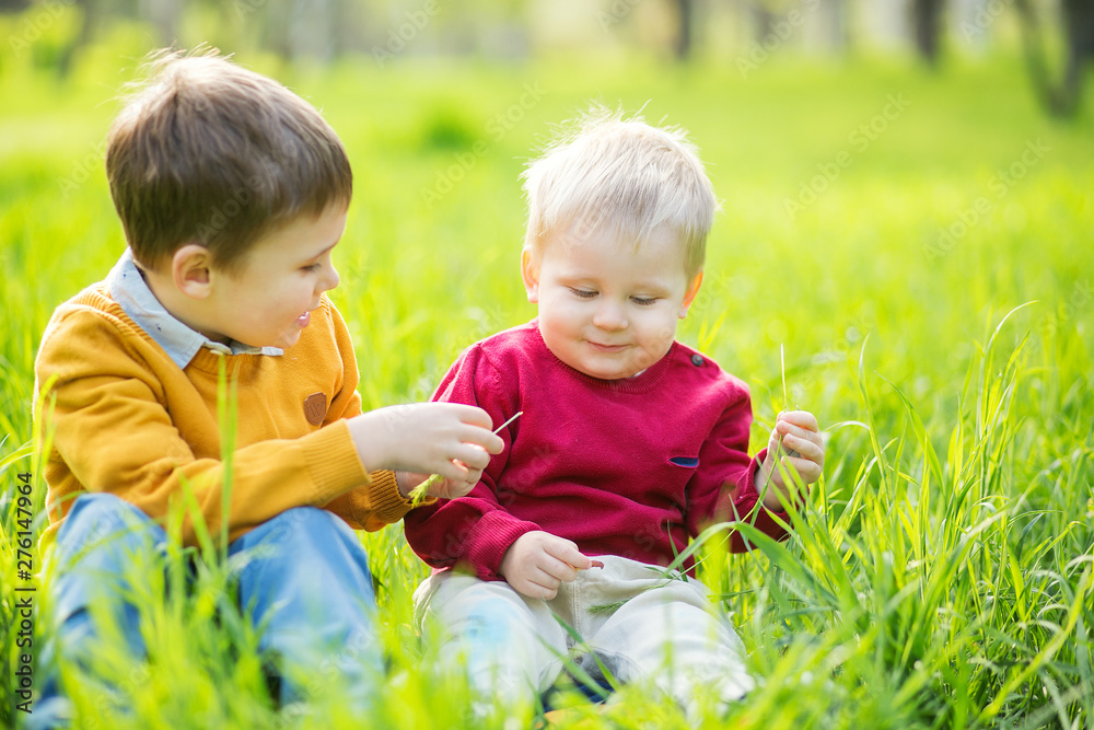 Two cute little boys playing outdoor in park. Two cute little boys playing outdoor in park.