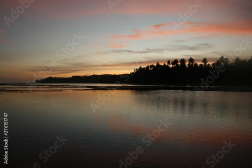 CALM WATERS ON SUNRISE AT NIAS INDONESIA