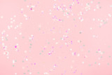 Pink background with delicate holographic sparkles. Perfect for backdrop for your design.