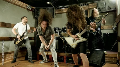 Musical metal band. Punk, heavy metal or rock group. Musicians playing music on stage. 4K