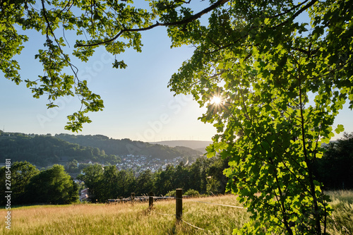 A beautiful scenic view into a rural German summer landscape in the Spessart with the town Bad Orb, Hessen