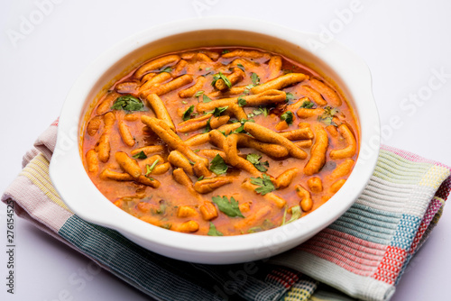 Dhaba style Sev bhaji/sabzi/curry made in tomato curry with gathiya shev, served in a bowl or karahi, selective focus