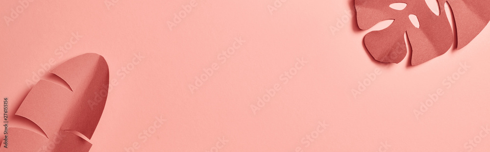 panoramic shot of decorative paper cut exotic leaves on pink background with copy space - obrazy, fototapety, plakaty 
