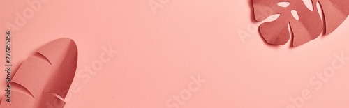 Fototapeta panoramic shot of decorative paper cut exotic leaves on pink background with copy space
