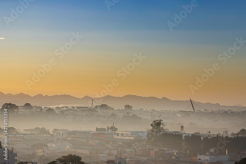 Sunrise with morning haze over the city