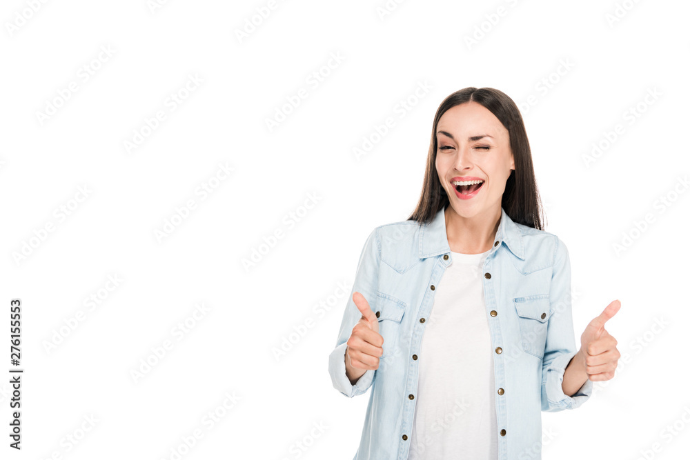 happy winking brunette woman showing thumbs up isolated on white happy winking brunette woman showing thumbs up isolated on white
