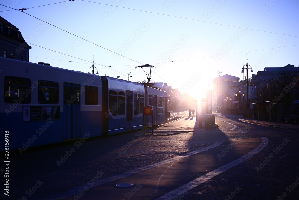 Early winter morning on a tram stop with strong sunlight on the Avenue, Gothenburg, Sweden Early winter morning on a tram stop with strong sunlight on the Avenue, Gothenburg, Sweden