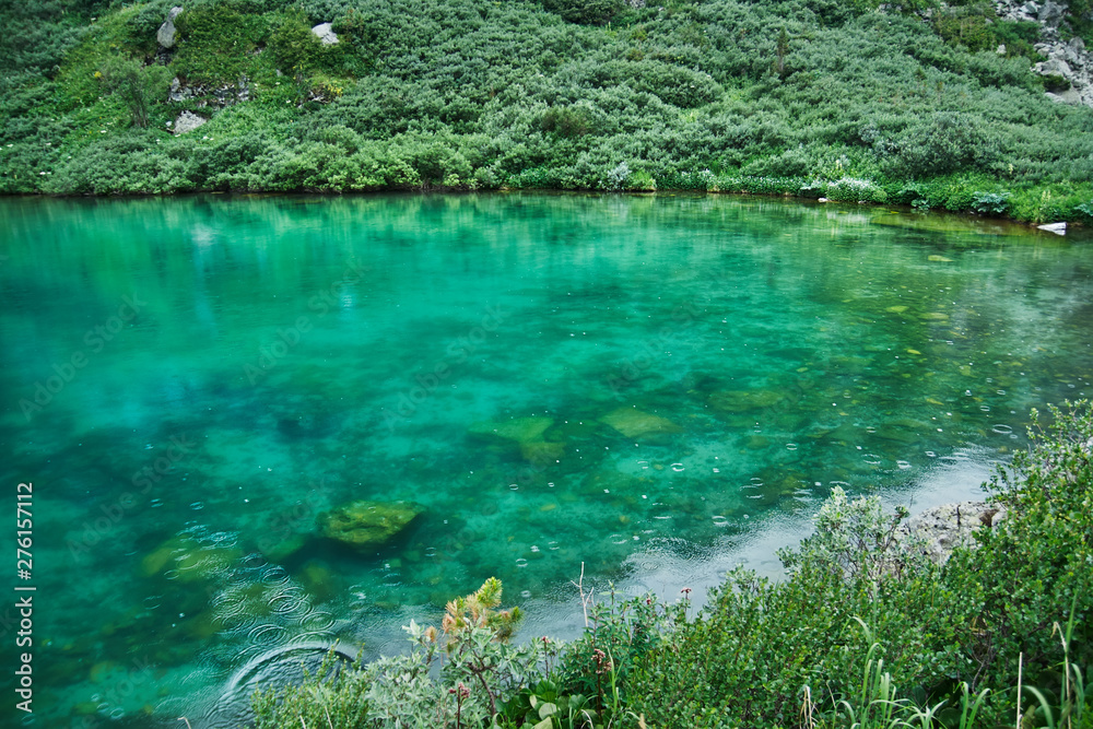 Clear water and the bottom of a mountain lake