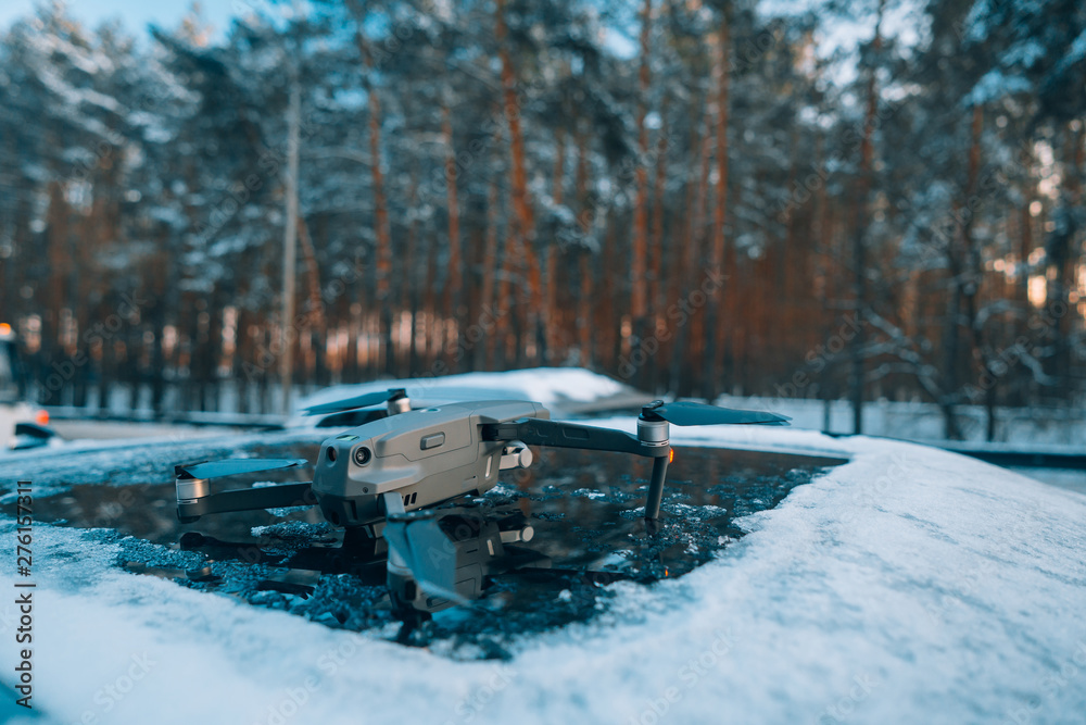custom made wallpaper toronto digitalquadrocopter standing on the roof of a snow-covered car